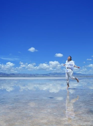 Photo of woman running on beach